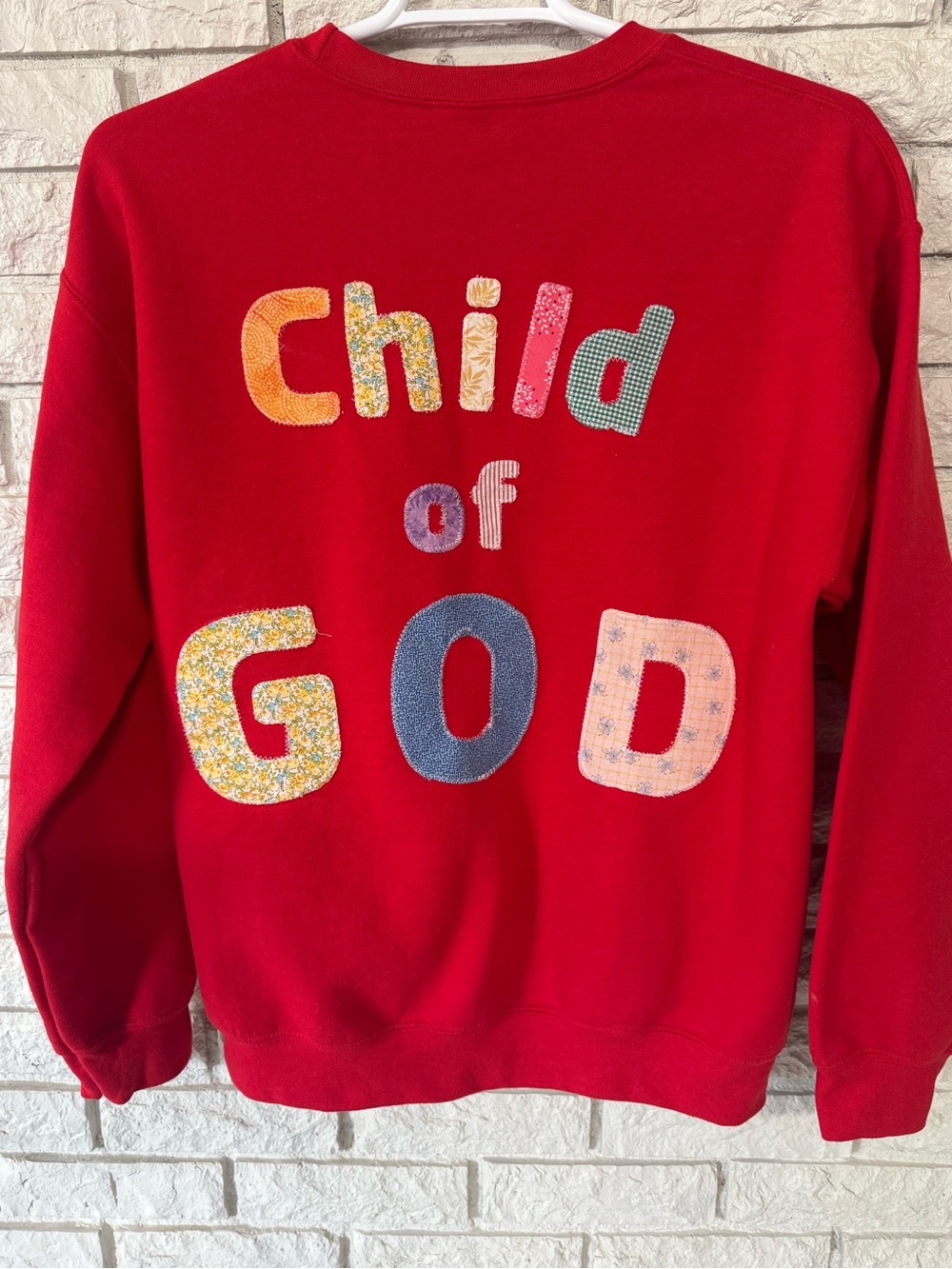 Boutique Red “Child of God” patchwork, crewneck sweatshirt  
Size Large